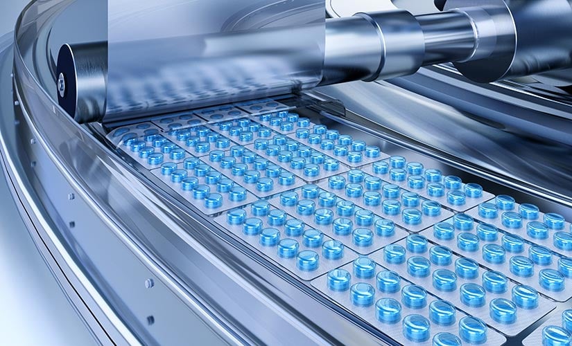 Blue pills in shrink wrap packaging in manufacturing facility pharmaceutical ERP software.