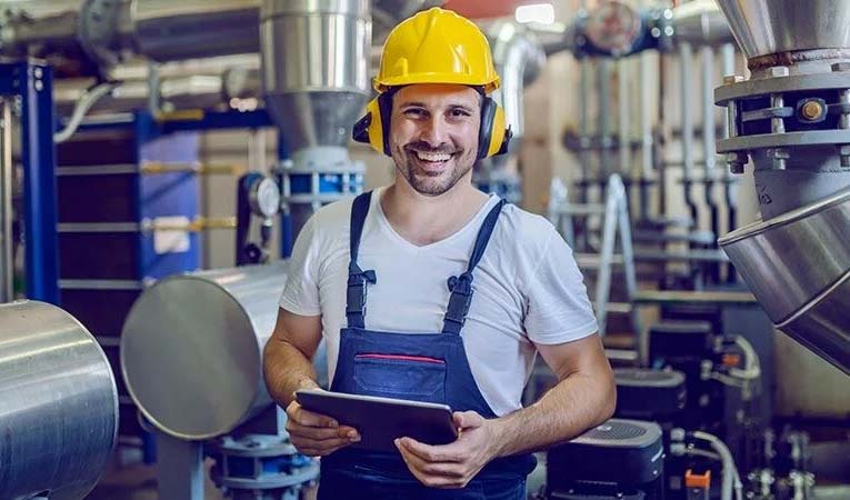 Manufacturing worker using best eQMS software 